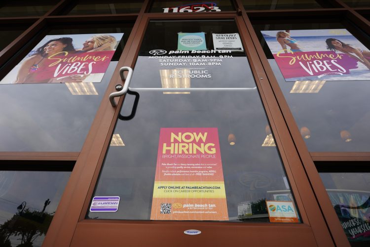 US jobless claims hit a pandemic low as hiring strengthens
